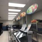 This AFTER pic shows a much brighter food line in the student cafeteria following installation of LED tubes.
