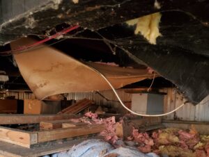 Collapsed insulation beneath a mobile home